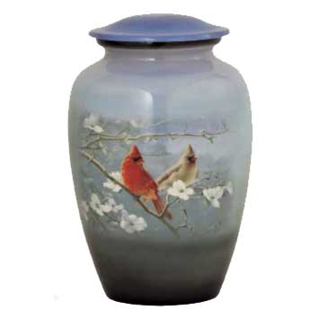 Hand painted memorial urn with cardinals painted on it